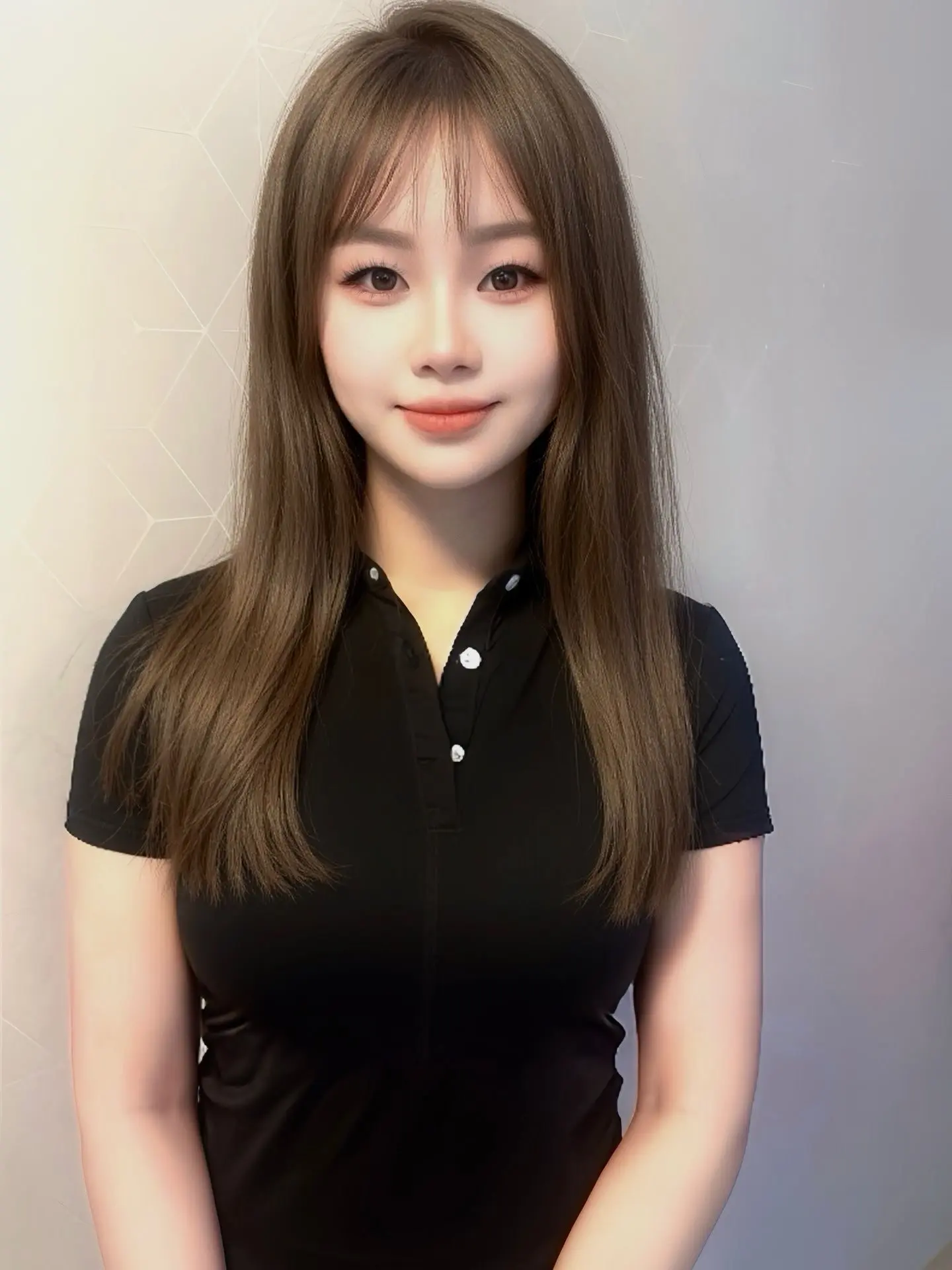 JAS SPA employee wearing black shirt, badge visible.