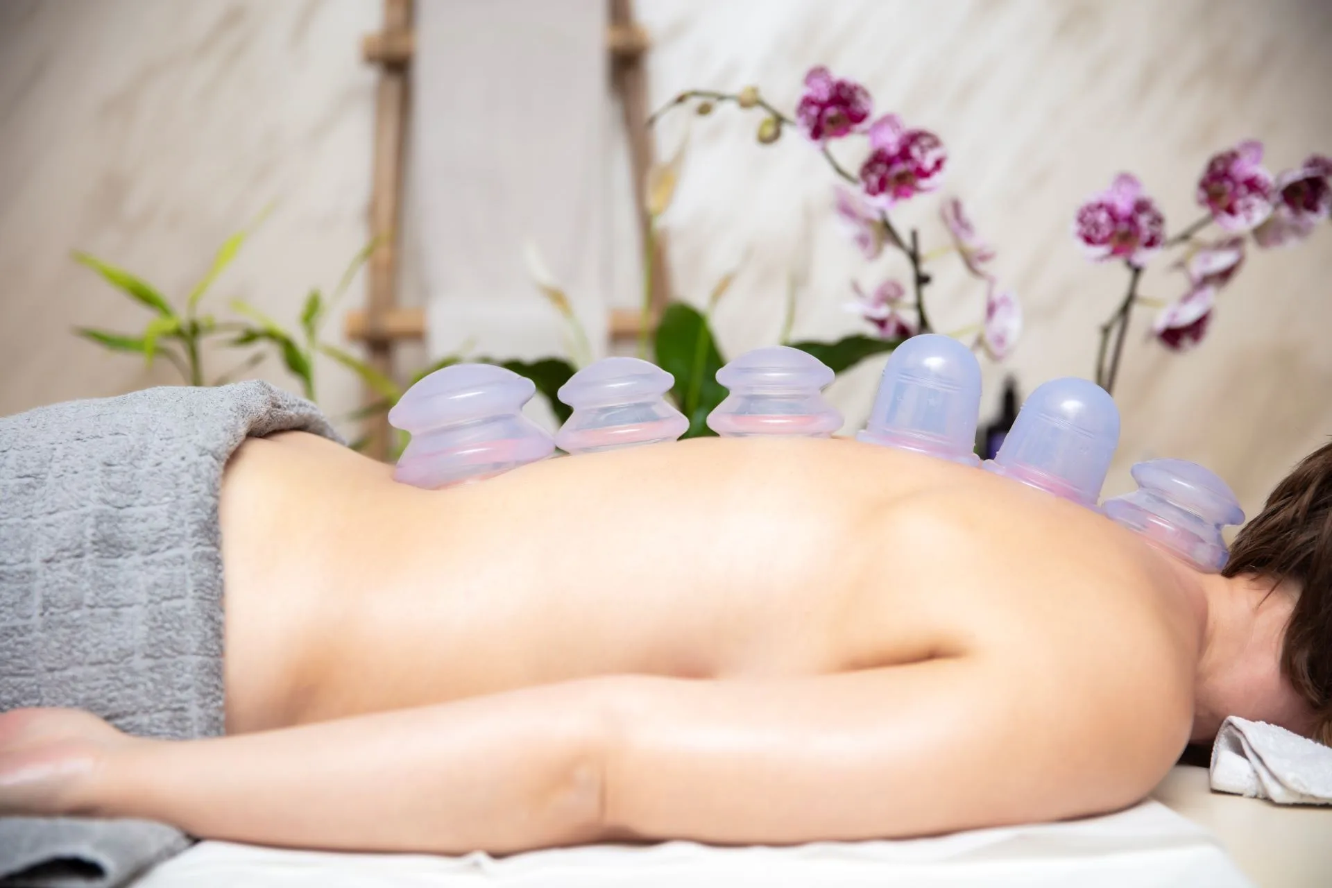 Hair removal device and spa essentials on table.