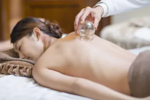 Relaxing cupping therapy on woman's back